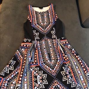 Zip front sleeveless knee length dress